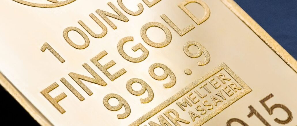 Detailed close-up of a 1 ounce fine gold bar with inscriptions, ideal for finance and investment themes.