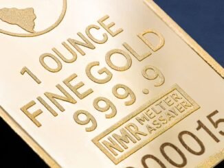 Detailed close-up of a 1 ounce fine gold bar with inscriptions, ideal for finance and investment themes.