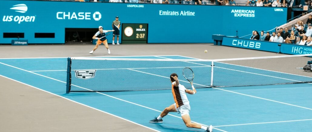 Dynamic scene of players in action at the US Open on a bright tennis court.