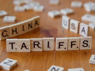 Wooden letter blocks spelling tariffs, China, and USA representing trade relations.