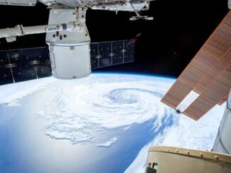 A mesmerizing view of Earth as seen from a space station with solar panels and satellite modules.