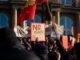 Crowd in Stuttgart demonstrating against AfD with signs and banners.