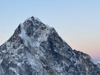 Snow-capped peak in the Himalayas, Nepal, captured during a serene sunset.