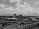 Aerial view of Memphis skyline with highways and river in black and white.