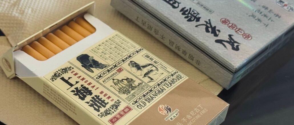 Open box of nicotine-free teabacco with vintage Shanghai design.