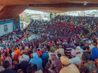 Large audience at a graduation ceremony in Ife, Nigeria, showcasing cultural diversity and academic celebration.