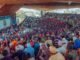 Large audience at a graduation ceremony in Ife, Nigeria, showcasing cultural diversity and academic celebration.